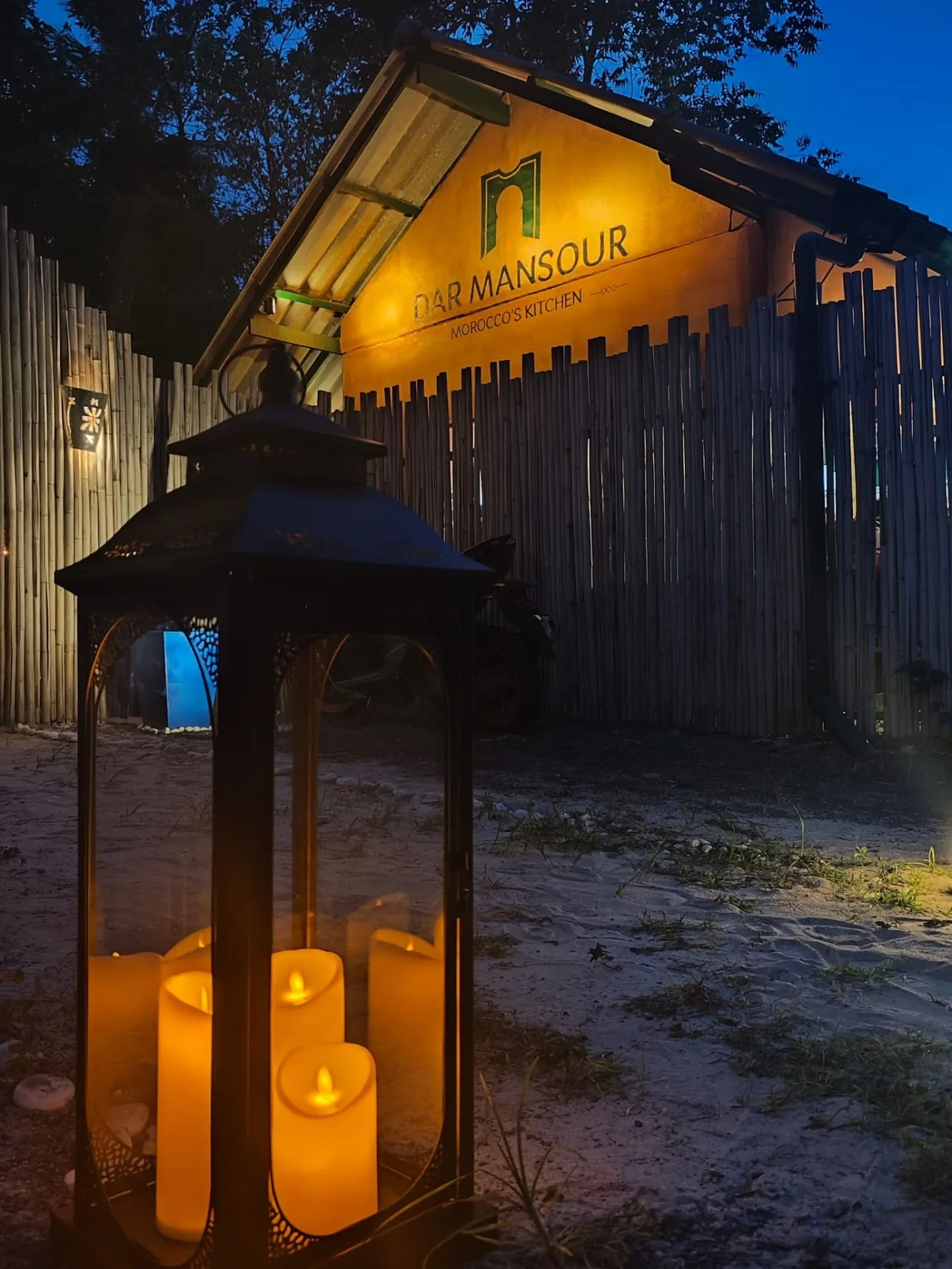 Dar Mansour entrance and lantern at dusk in Koh Phangan