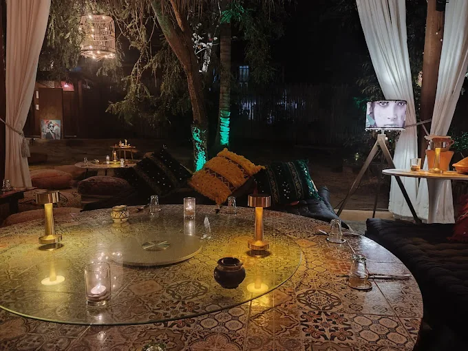 Moroccan garden lounge at night at Dar Mansour